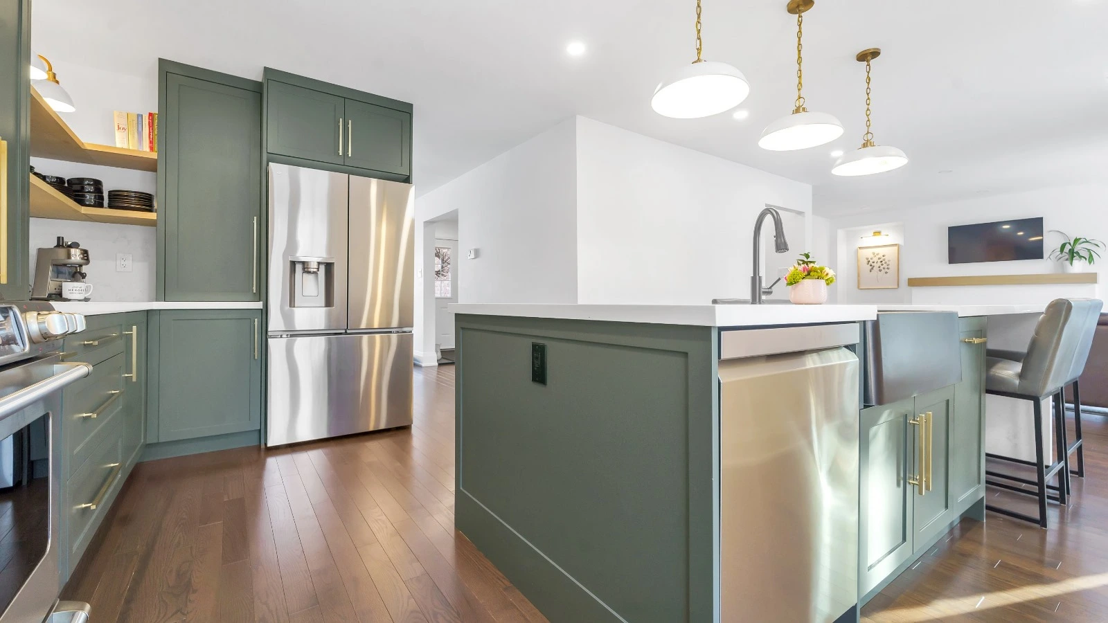 Modern green kitchen cabinets with island and stainless steel appliances Oakville