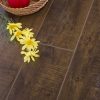 Apples and flowers on wooden floor