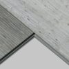 Two textured floor tiles meeting edge
