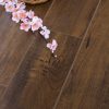 Apples and flowers on wooden floor.