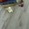 Books, figurine, and flowers on floor.