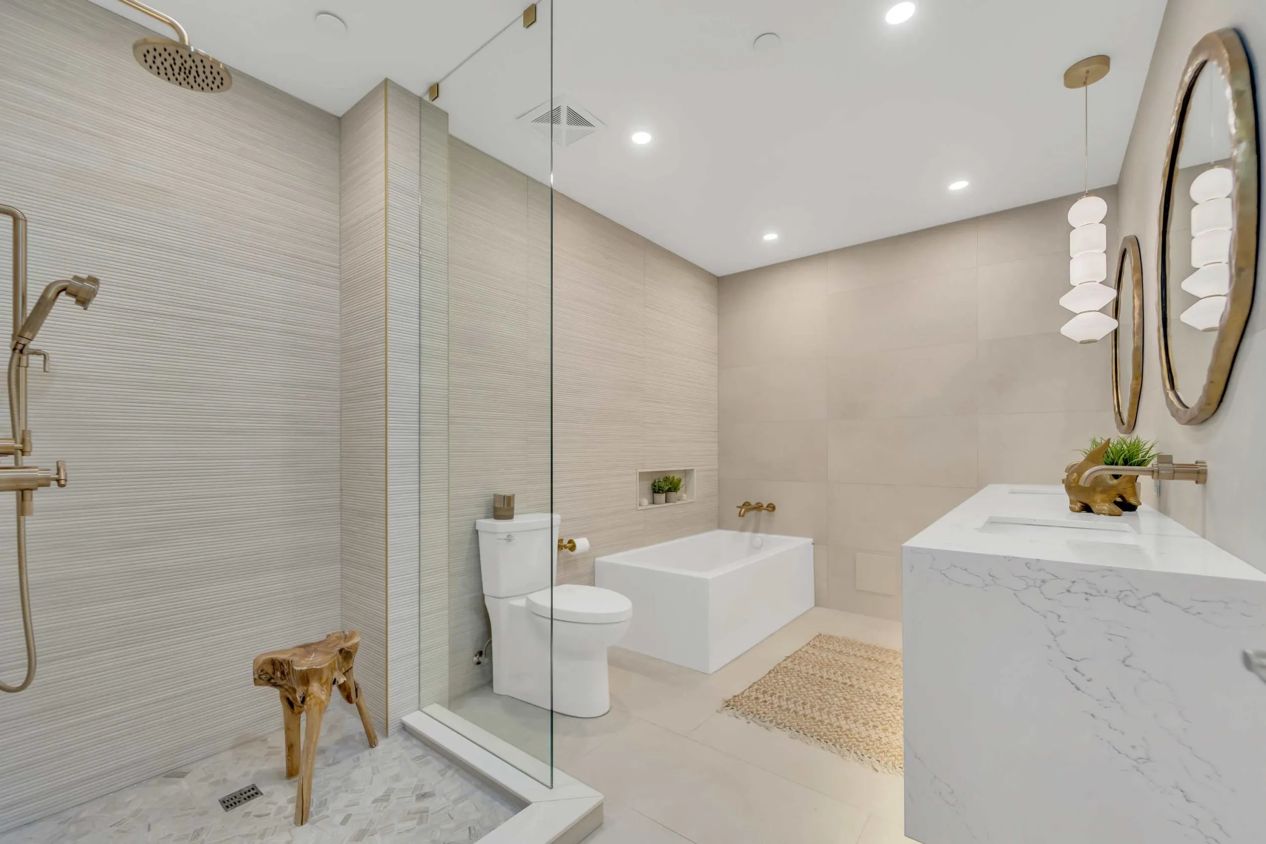 Luxury bathroom renovation with glass shower, freestanding tub and beige wall tiles Oakville Luxury bathroom renovation with glass shower, freestanding tub and beige wall tiles Oakville